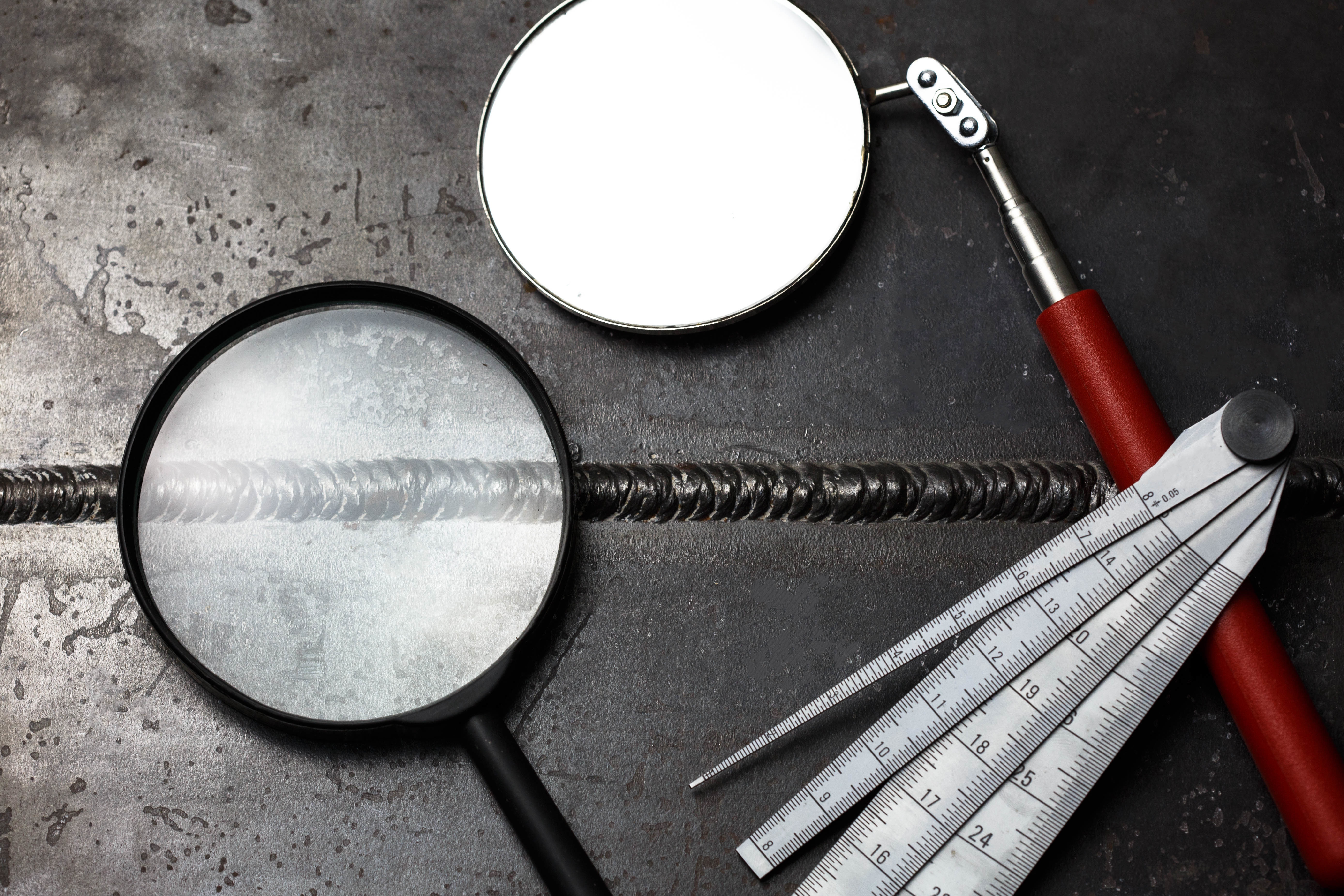 Certified Welding Inspector performing weld inspection
